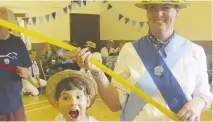  ??  ?? Daniel Ricketts and his mum Karen Ricketts who is squire (leader) of Hurst Morris People at the side’s maypole and morris day