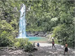  ??  ?? Tavoro Waterfalls, in Bouma National Heritage Park, is one of Taveuni’s top attraction­s.