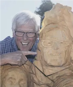  ?? PICTURES: PA ?? John Craven, main; with his chainsaw-carved likeness at Countryfil­e Live last year, above