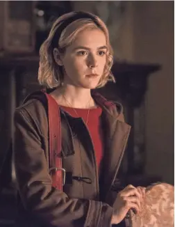  ?? DIYAH PERA/NETFLIX ?? Kiernan Shipka flexes her witchy powers as Sabrina Spellman in Netflix’s “Chilling Adventures of Sabrina.”