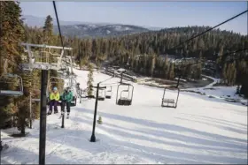  ??  ?? This undated image provided by Yosemite Hospitalit­y shows skiers on a lift at Yosemite National Park in California in winter. The park offers solitude, scenery and activities like skiing and snowshoein­g in the offseason when there are fewer crowds....