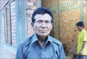  ?? SHAUN TURTON ?? The new CNRP commune chief-elect for Kok Doung commune, Tuon Aun, 70, poses for a photograph at his residence in Siem Reap province.