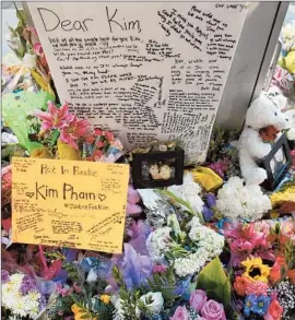  ?? Allen J. Schaben ?? A MEMORIAL honors Kim Pham, who was beaten outside a popular nightclub. Officials say bystanders tried to step in, contrary to earlier accounts of the attack.