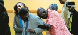  ?? JOHN RAOUX/AP ?? St. Paul AME Church parishione­rs pray at a service Sunday for victims of Saturday’s shooting in Jacksonvil­le, Fla.