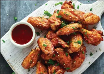  ?? GETTY IMAGES ?? Chicken wings are classic Super Bowl fare.