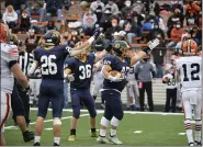  ?? PAUL DICICCO — FOR THE NEWS-HERALD ?? Kirtland’s Nick Schwartz signals a change in possession after a fumble recovery Nov. 21 during the Division V state final against Ironton in Massillon.