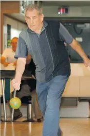  ?? RACHEL PSUTKA/Leader-Post photos ?? Stan Luzny, 92, shows his form on the lanes while enjoying some five-pin bowling. Luzny is celebratin­g his 50th year of continuous bowling.