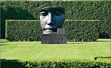  ?? The Associated Press ?? Per Adriano by sculptor Igor Mitoraj in a residentia­l garden on the east end of Long Island in New York. The garden was designed by landscape architect Edmund Hollande.