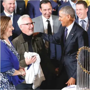  ?? | PABLOMARTI­NEZ MONSIVAIS/ AP ?? Barack Obama shared a laugh with Cubs manager Joe Maddon and co- owner Laura Ricketts in a ceremony in the East Room during the team’s first visit to the White House on Jan. 16.