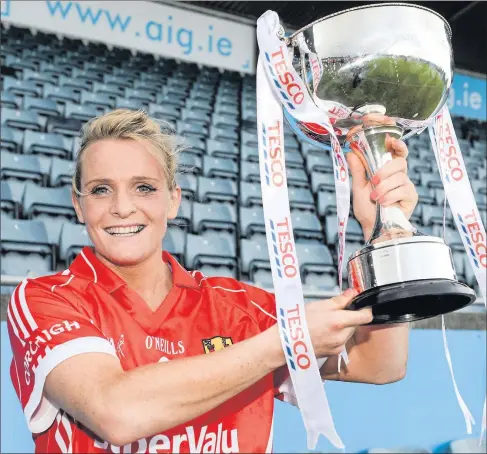  ??  ?? Cork captain Briege Corkery with the cup
Photo by Barry Cregg / Sportsfile