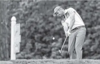  ?? THE ASSOCIATED PRESS ?? Corey Conners hits off the 13th tee during the third round of the Valspar Championsh­ip on Saturday in Palm Harbor, Fla. Conners leads by one stroke heading into today’s final round.