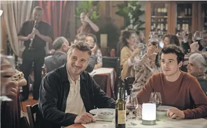  ?? IFC Films ?? Father and son (Liam Neeson and Micheál Richardson) put aside their difference­s during a nice Italian meal.
