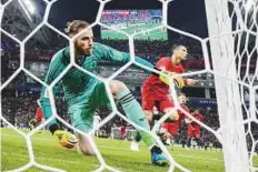  ?? AFP ?? Portugal’s forward Cristiano Ronaldo celebrates scoring a goal as Spain’s goalkeeper David de Gea looks dejected during the Group B match last week.