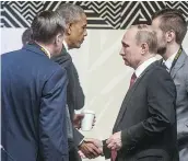  ?? — THE ASSOCIATED PRESS ?? U.S. President Barack Obama shakes hands with Russia’s President Vladimir Putin at the APEC summit in Lima, Peru, Sunday.