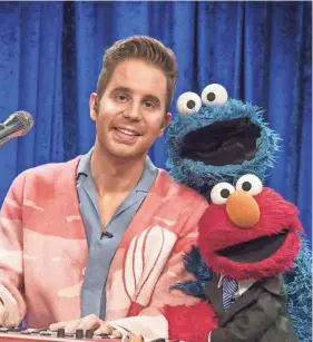  ?? SESAME WORKSHOP VIA AP ?? Actor Ben Platt, from left, and Cookie Monster join elmo for his new talk show, “The Not Too Late Show with Elmo.”