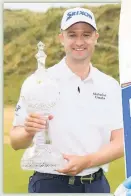  ??  ?? WINNER Knox shows off the trophy after play-off victory