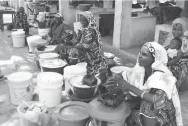  ?? PHOTOS: ?? Women selling Fura da nono in the market Shehu Abubakar