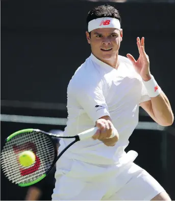  ?? KIRSTY WIGGLESWOR­TH/AP ?? Canada’s Milos Raonic returns a shot to Liam Broady of Britain during first-round singles action at Wimbledon on Monday in London. The 13th-ranked Raonic won the match, 7-5, 6-0, 6-1.