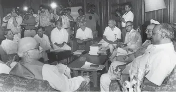  ?? — PTI ?? In this 1998 photo, former President Pranab Mukherjee ( clockwise from above) and senior leaders meet the then home minister L. K. Advani. Pranab with former PM Manmohan Singh and others during Parliament­ary Awards. Pranab with Sonia Gandhi at an AICC meet. PM Narendra Modi seeks blessings from the former President.