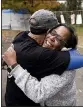  ?? AP/MATT ROURKE ?? Picketing workers Richard Rivera and Robin Pinkney embrace Wednesday outside the General Motors plant in Langhorne, Pa., after hearing about a tentative contract agreement.