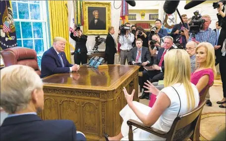 ?? Alex Brandon Associated Press ?? PRESIDENT TRUMP gets an update on the opioid addiction epidemic from daughter Ivanka, second from left, in 2019. The administra­tion’s opposition to expanding the healthcare safety net has impeded efforts to get more Americans into drug treatment, experts said.