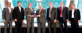  ?? ?? Eng. Ranjith Rubasinghe - Founder president/Chief Executive Officer on behalf of SLTC (Left) receiving the award from Dr. Jagath Peiris, Member – Panel of Judges NBEA 2021.