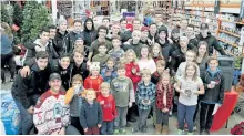  ?? SUBMITTED PHOTO ?? Peterborou­gh Petes players joined with a group of local home-schooled children on Friday for the Operation Christmas Child Shoebox Packing event at Home Depot.