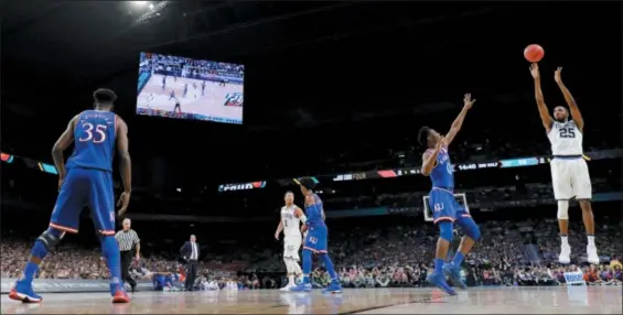  ?? DAVID J. PHILLIP — THE ASSOCIATED PRESS ?? Villanova’s Mikal Bridges (25), a Great Valley High School product, shoots a 3-point basket against Kansas during the second half of the national semifinal Saturday in San Antonio.