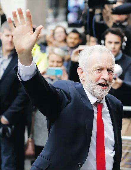  ?? FRANK AUGSTEIN / THE ASSOCIATED PRESS ?? Jeremy Corbyn waves as he arrives at Labour party headquarte­rs in London on Friday.