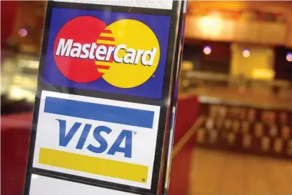  ?? AP FILE ?? Visa and Mastercard on Tuesday announced a settlement with U.S. merchants related to swipe fees, a developmen­t that could potentiall­y save consumers tens of billions of dollars.