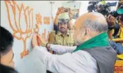  ?? PTI PHOTO ?? BJP president Amit Shah at a doortodoor campaign in Davangere, Karnataka on Tuesday. The state goes to polls on May 12.