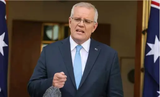  ?? AFP/VNA
Photo ?? Prime Minister Scott
Morrison's tenure has been beset by
a rolling series of crises, from climatefue­lled droughts, bushfires and floods to the global COVID-19
pandemic.