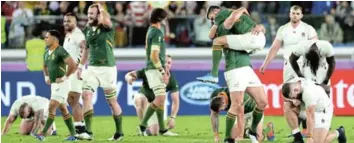  ?? Picture: GETTY IMAGES ?? GROUNDED: Willie Le Roux jumps on teammate Frans Steyn as they celebrate their victory as Luke Cowan-Dickie reacts following the World Cup 2019 Final. Springboks have not played since the World Cup final and have pulled out of the Rugby Championsh­ips.