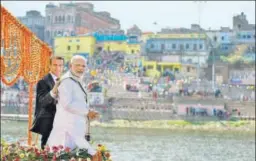  ?? PTI PHOTO ?? Prime Minister Narendra Modi and French President Emmanuel Macron enjoy a boat ride on the banks of the Ganga in Varanasi on Monday. >> P9