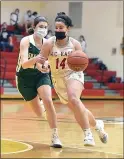  ?? PETE BANNAN — MEDIANEWS GROUP ?? West Chester East’s Mary Grace Kerns (14) drives the lane in the third quarter as Bishop Shanahan’s Shannon Donahue (25) defends.