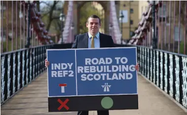 ??  ?? Scottish Tory leader Douglas Ross unveiled his party’s plan at Glasgow’s South Portland Street suspension bridge