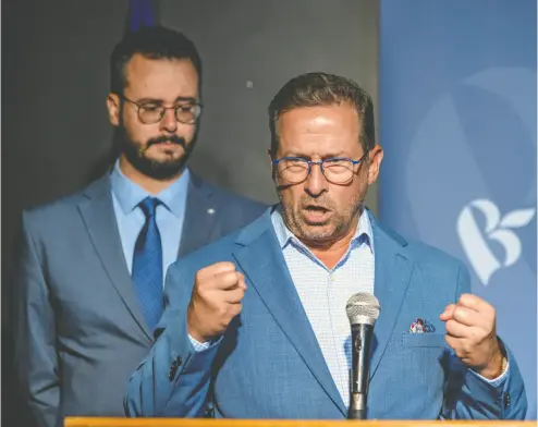  ?? JOHN MAHONEY / POSTMEDIA NEWS ?? Louis-philippe Sauvé stands behind Bloc Québécois Leader Yves-françois Blanchet at a news conference
the day after Sauvé’s byelection victory in the Lasalle-émard-verdun riding in Montreal.