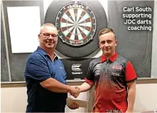  ?? ?? Carl South supporting JDC darts coaching