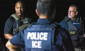  ?? JOHN SPINK/JSPINK@AJC.COM ?? (From left) Supervisor Damian Streetz, Deputy Field Office Director Joe Sifuentez and Assistant Field Office Director Bill McCafferty prepare for an arrest. “When my officers go out in the field every day, they are looking for specific people,” said...