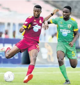  ?? FILE ?? Rushan Parkinson of Dinthill High tries to get away from Excelsior’s Junior Parker in their ISSA Champions Cup match-up at the National Stadium in November 1, 2019.