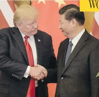  ?? FRED DUFOUR / AFP / GETTY IMAGES ?? U.S. President Donald Trump shakes hands with Chinese President Xi Jinping at the Great Hall of the People in Beijing. Trump addressed China with a gentler tone than he’d used during his presidenti­al campaign.