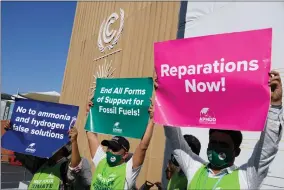  ?? AP PHOTO BY PETER DEJONG ?? A group of demonstrat­ors participat­e in an event protesting the use of fossil fuels and calling for reparation­s at the COP27 U.N. Climate Summit, Wednesday, Nov. 9, 2022, in Sharm el-sheikh, Egypt.