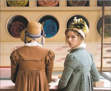  ?? Focus Features ?? ANYA TAYLOR-JOY, right, stars as Emma Woodhouse in “Emma,” whose wealth spares her from the sartorial tasks of her friends.