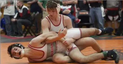  ?? JEN FORBUS — FOR THE MORNING JOURNAL ?? Firelands’ Payton Burgdorf keeps a tight grip on Fairview’s Adam Samad and comes out the winner in the 120 championsh­ip round on Feb. 9.