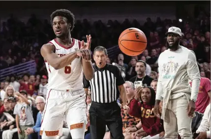  ?? MARK. J. TERRILL/ASSOCIATED PRESS ?? Having his son, Bronny (6), play college ball in the same town as he plays pro ball has enabled LeBron James to attend some USC games, like this one against Long Beach State.