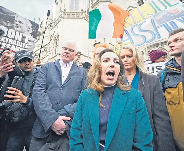  ?? ?? Stella Assange addresses her husband’s supporters outside the High Court in London before his appeal proceeding­s begin. Backers of the Wikileaks founder claim he faces 175 years in prison if he is extradited.