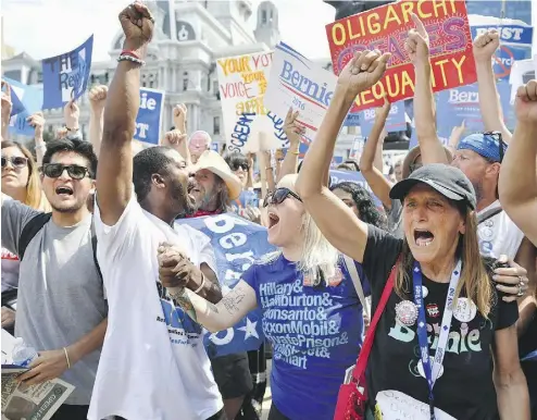  ?? JEFF J. MITCHELL / GETTY IMAGES ?? Bernie Sanders supporters gather at the Democratic National Convention (DNC) on Wednesday in Philadelph­ia, Pa.