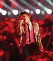  ?? AP PHOTO BY BILL KOSTROUN ?? In this 2014 file photo, Bruno Mars performs during the halftime show of the NFL Super Bowl XLVIII football game between the Seattle Seahawks and the Denver Broncos in East Rutherford, N.J.