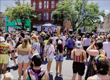  ?? Paul Buckowski / Times Union ?? People gather June 13 for the inaugural 2021 Capital Pride BBQ and Block Party outside of the Waterworks Pub and Rocks on Central Avenue in Albany.