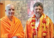  ?? ?? D.K. Shivakumar with pontiff of Adi Chunchanag­iri math, Sri Nirmalanan­da Swamiji, in Nagamagala.